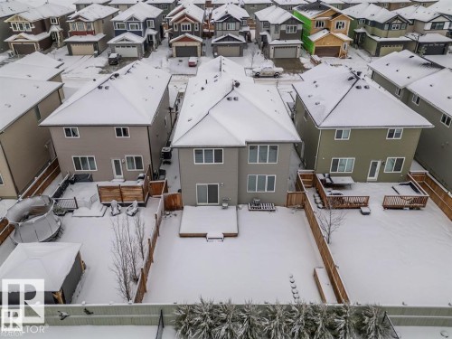 The property features a fenced backyard with a patio area - 3608 46 Avenue, Beaumont, AB - Outdoor