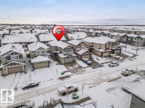 Aerial view of the neighborhood with a residential street and properties featuring gabled roofs - 3608 46 Avenue, Beaumont, AB - Outdoor