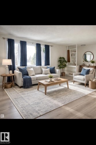 The living room features hardwood flooring, large windows with blue curtains, and a built-in shelving unit - 14911 77 Street Nw, Edmonton, AB - Indoor Photo Showing Living Room