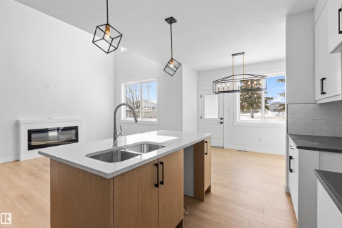 5133 53 Avenue, Calmar, AB - Indoor Photo Showing Kitchen With Fireplace With Double Sink