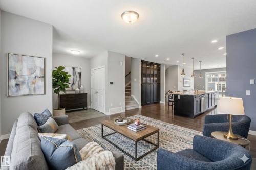 The living area features hardwood floors and recessed lighting - 5014 Dewolf Road, Edmonton, AB 