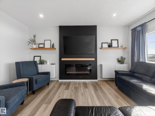 9 Prospect Place, Spruce Grove, AB - Indoor Photo Showing Living Room With Fireplace