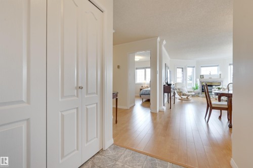 The property features light-toned wood flooring throughout the living areas, complemented by white walls and trim - 304 17151 94A Avenue, Edmonton, AB - Indoor Photo Showing Other Room