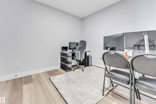 This room features light-colored walls and hardwood flooring - 1531 151 Avenue, Edmonton, AB - Indoor Photo Showing Office