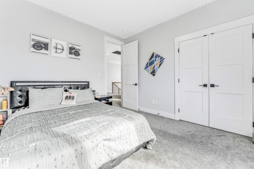 This room features light grey walls, white trim, and light grey carpet - 1531 151 Avenue, Edmonton, AB - Indoor Photo Showing Bedroom
