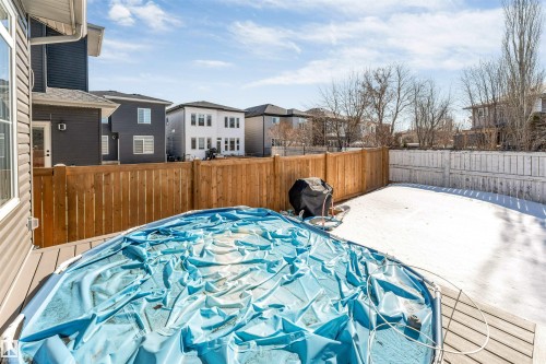 The property features a fenced yard with a deck and an above-ground pool - 1531 151 Avenue, Edmonton, AB - Outdoor