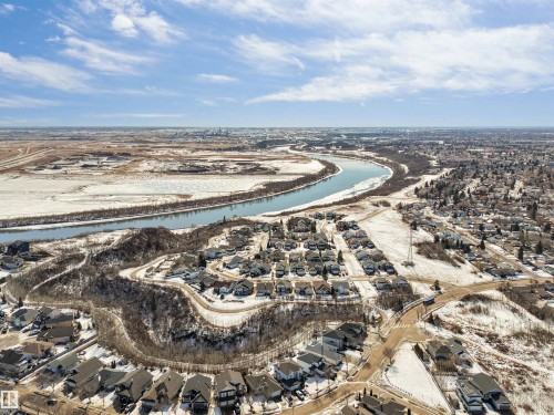 Expansive aerial view showcasing the river, surrounding residential areas, and distant cityscape under a bright sky - 1531 151 Avenue, Edmonton, AB - Outdoor With View