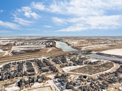 Aerial view of the neighborhood showcasing residential properties, a river, and a highway - 1531 151 Avenue, Edmonton, AB - Outdoor With View