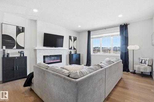 7012 54 Avenue, Beaumont, AB - Indoor Photo Showing Living Room With Fireplace