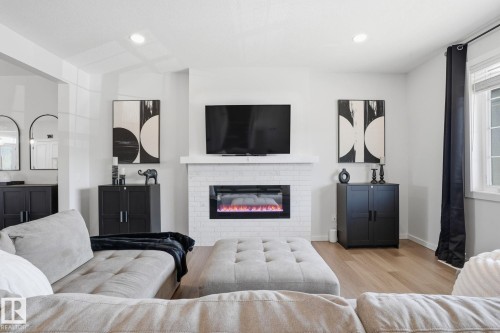 7012 54 Avenue, Beaumont, AB - Indoor Photo Showing Living Room With Fireplace