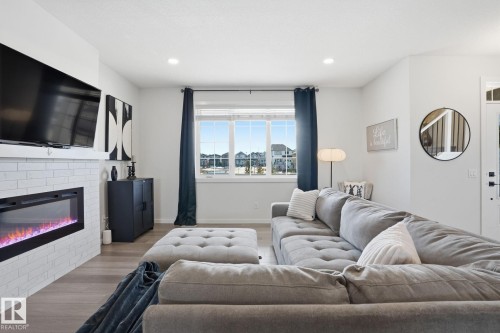 7012 54 Avenue, Beaumont, AB - Indoor Photo Showing Living Room With Fireplace