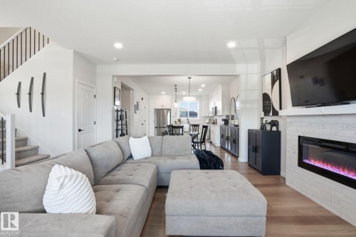 7012 54 Avenue, Beaumont, AB - Indoor Photo Showing Living Room With Fireplace