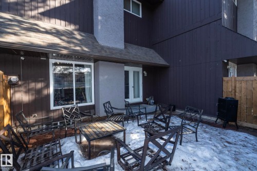 The property features a private patio area with a white door and window, offering direct access to the interior - 6 Glaewyn Estates, St. Albert, AB - Outdoor With Deck Patio Veranda With Exterior