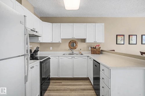 411 65 Gervais Road, St. Albert, AB - Indoor Photo Showing Kitchen With Double Sink