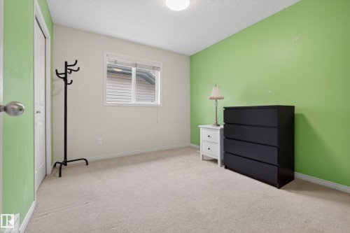 This room features a window providing natural light, a neutral-toned carpet, and a light-colored ceiling - 1119 Rutherford Close, Edmonton, AB - Indoor