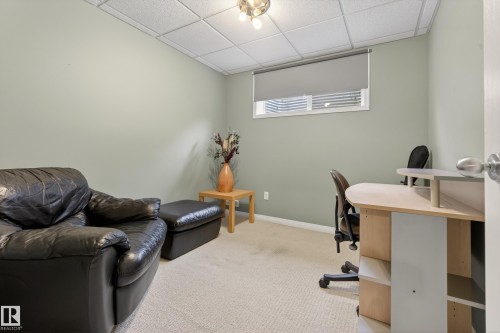 This versatile room features light-colored walls, carpeted flooring, and a drop ceiling with recessed lighting - 1119 Rutherford Close, Edmonton, AB - Indoor Photo Showing Other Room