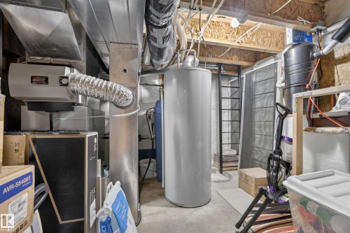 Property utilities including a water heater and furnace with ductwork - 1119 Rutherford Close, Edmonton, AB - Indoor Photo Showing Basement