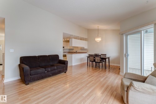 The main living area features light-toned flooring, a dining area - 5 308 Jackson Road, Edmonton, AB - Indoor Photo Showing Living Room