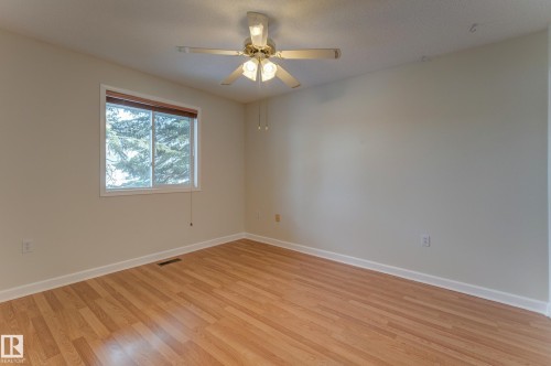 This room features a window with a view of greenery, and a ceiling fan with integrated lighting - 5 308 Jackson Road, Edmonton, AB - Indoor Photo Showing Other Room