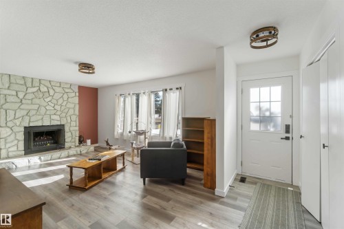 104 Oak Drive, Wetaskiwin, AB - Indoor Photo Showing Living Room With Fireplace