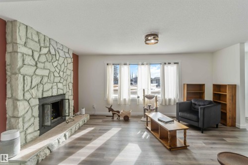 104 Oak Drive, Wetaskiwin, AB - Indoor Photo Showing Living Room With Fireplace