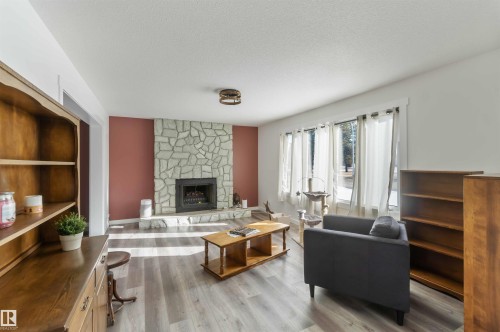 104 Oak Drive, Wetaskiwin, AB - Indoor Photo Showing Living Room With Fireplace