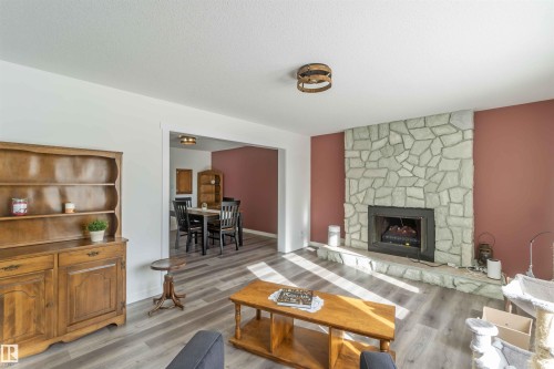 104 Oak Drive, Wetaskiwin, AB - Indoor Photo Showing Living Room With Fireplace