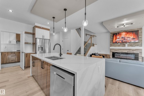 16115 34 Avenue, Edmonton, AB - Indoor Photo Showing Kitchen With Fireplace With Double Sink With Upgraded Kitchen