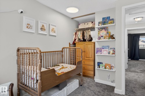 This room features light gray walls and dark gray carpet - 1873 151 Avenue, Edmonton, AB - Indoor Photo Showing Bedroom