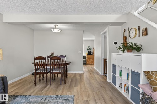 Open concept living space featuring light wood-style flooring and light-colored walls - 1873 151 Avenue, Edmonton, AB - Indoor Photo Showing Other Room