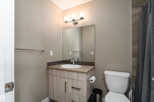 Full bath featuring vanity and curtained shower - 1964 Kroetsch Crescent, Edmonton, AB - Indoor Photo Showing Bathroom