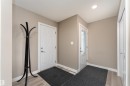 Entryway featuring light wood finished floors and a textured ceiling - 1964 Kroetsch Crescent, Edmonton, AB  - Indoor Photo Showing Other Room 