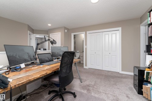 Office space with light colored carpet, a textured ceiling, and recessed lighting - 1964 Kroetsch Crescent, Edmonton, AB - Indoor Photo Showing Office