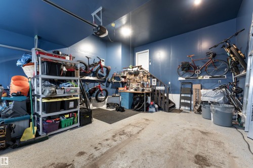 Garage featuring a workshop area and a garage door opener - 1964 Kroetsch Crescent, Edmonton, AB - Indoor Photo Showing Other Room