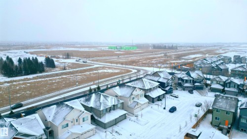 Snowy aerial view featuring a residential view - 1964 Kroetsch Crescent, Edmonton, AB - Outdoor With View