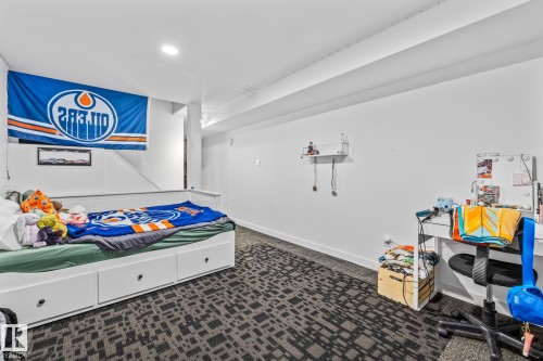 This room features carpeted flooring, white walls, and a recessed light fixture - 10940 Beaumaris Road, Edmonton, AB - Indoor