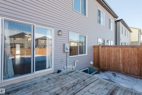 The property features a private deck area with wooden decking and a privacy fence - 2082 Price Landing, Edmonton, AB - Outdoor With Deck Patio Veranda With Exterior