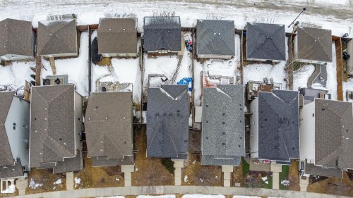 Aerial view showcasing the property's location within a residential neighborhood featuring various roof styles and patterns - 1522 Chapman Way, Edmonton, AB - Outdoor