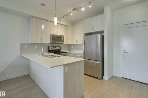 101 17 Columbia Avenue, Devon, AB - Indoor Photo Showing Kitchen With Stainless Steel Kitchen With Double Sink