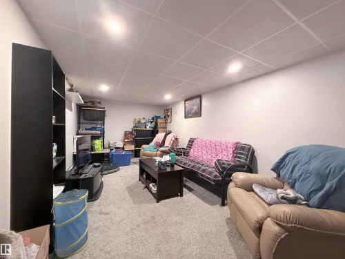 This room features a neutral color palette, recessed lighting, and carpeting - 3912 108 Street, Edmonton, AB - Indoor Photo Showing Other Room