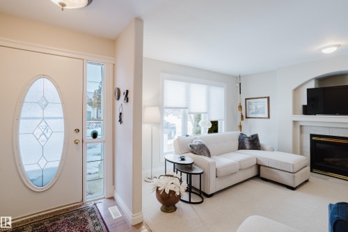 11660 15 Avenue Nw, Edmonton, AB - Indoor Photo Showing Living Room With Fireplace