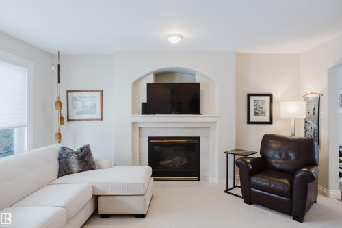 11660 15 Avenue Nw, Edmonton, AB - Indoor Photo Showing Living Room With Fireplace