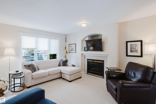 11660 15 Avenue Nw, Edmonton, AB - Indoor Photo Showing Living Room With Fireplace