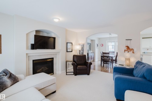 11660 15 Avenue Nw, Edmonton, AB - Indoor Photo Showing Living Room With Fireplace
