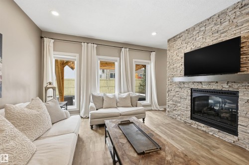 6477 Elston Loop, Edmonton, AB - Indoor Photo Showing Living Room With Fireplace