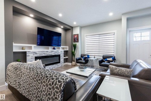 73 230 Edgemont Road, Edmonton, AB - Indoor Photo Showing Living Room With Fireplace