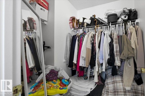 Closet with a hanging rod and an upper shelf - 5837 162A Avenue, Edmonton, AB - Indoor With Storage