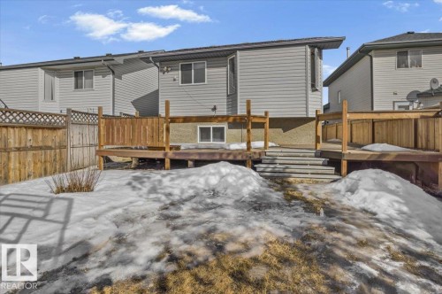 The property features a fenced yard with a wooden deck and steps - 5837 162A Avenue, Edmonton, AB - Outdoor With Deck Patio Veranda With Exterior
