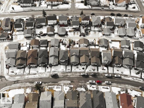 Aerial view of the neighborhood featuring residential properties with varying roof colors and street parking - 5837 162A Avenue, Edmonton, AB - Outdoor With View