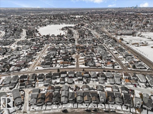 Aerial view of the neighborhood showcasing residential properties with snow-covered roofs and grounds - 5837 162A Avenue, Edmonton, AB - Outdoor With View